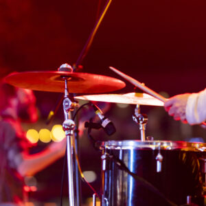 Drummer playing drums on stage